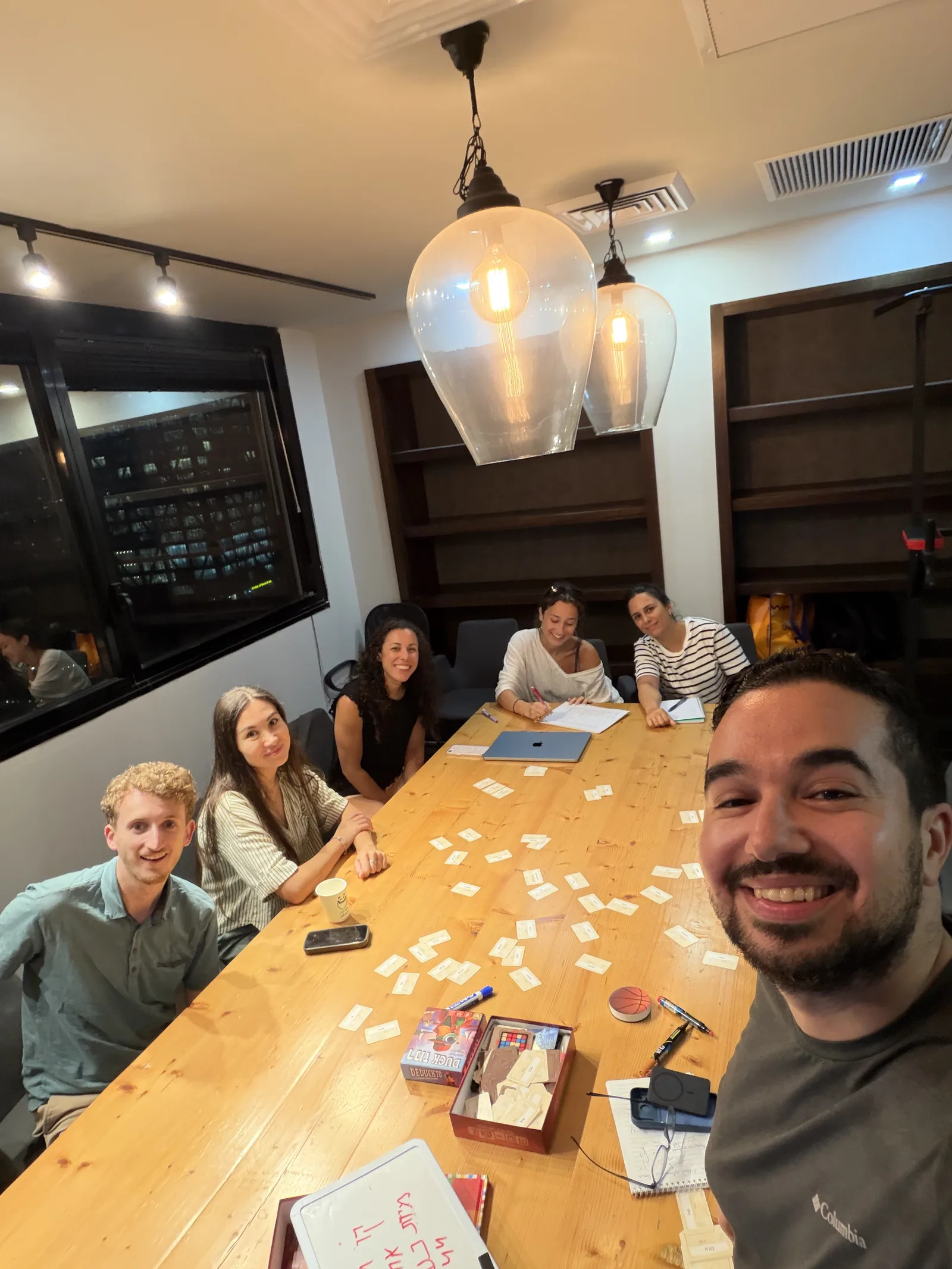 Small group Hebrew lesson around a table